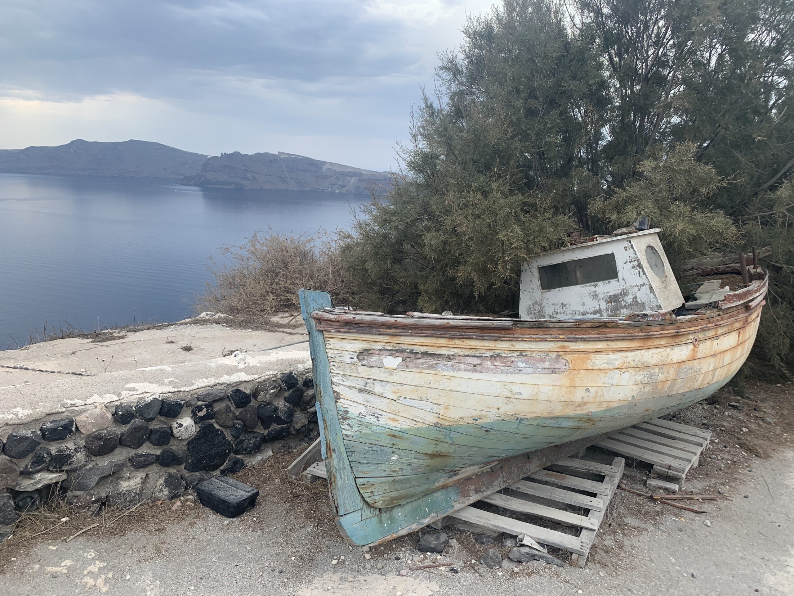 A dilapidated boat in Santorini, Greece