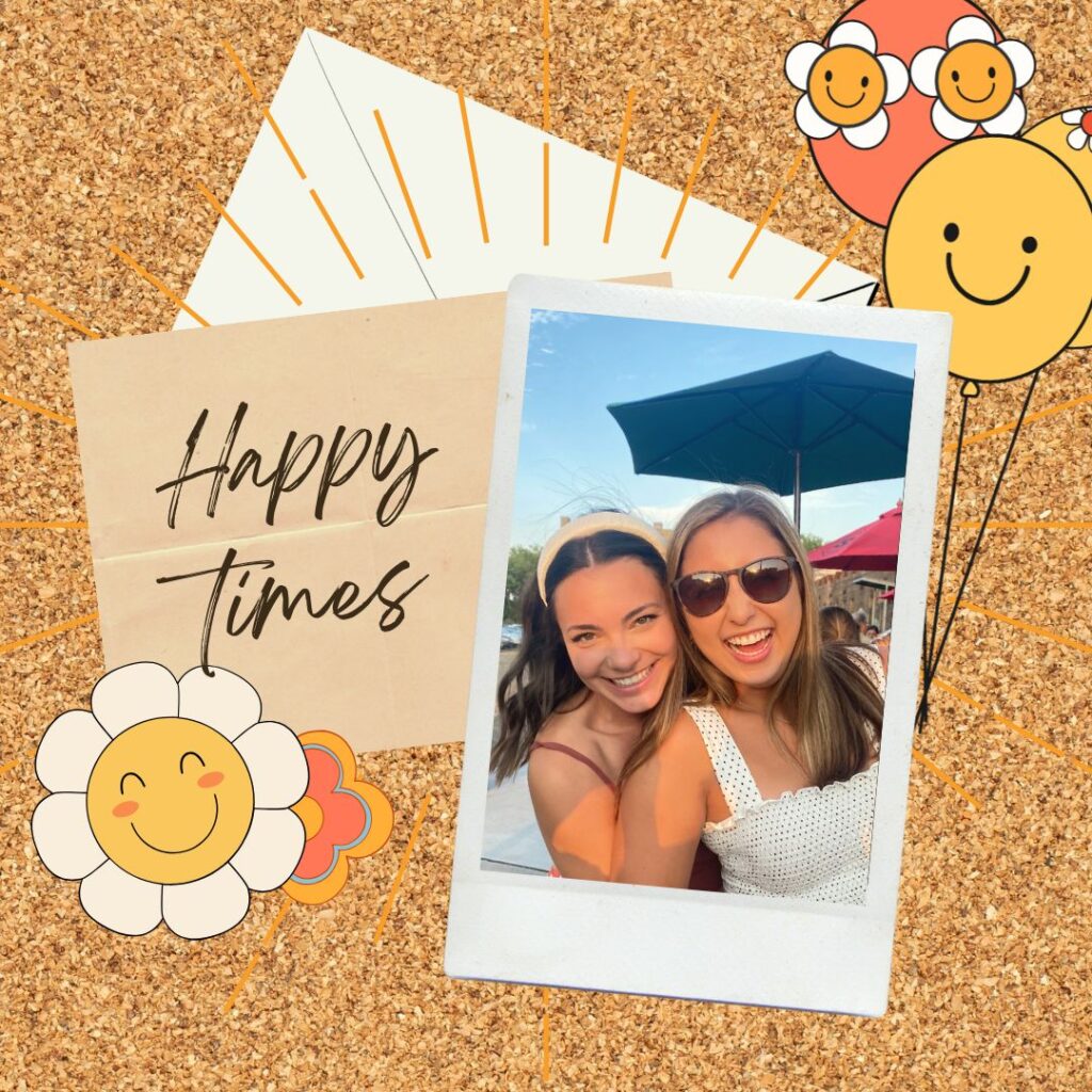 Two smiling women pose for a photo outdoors with a sun umbrella in the background. The image is on a corkboard with smiley face balloons and a "Happy Times" note.